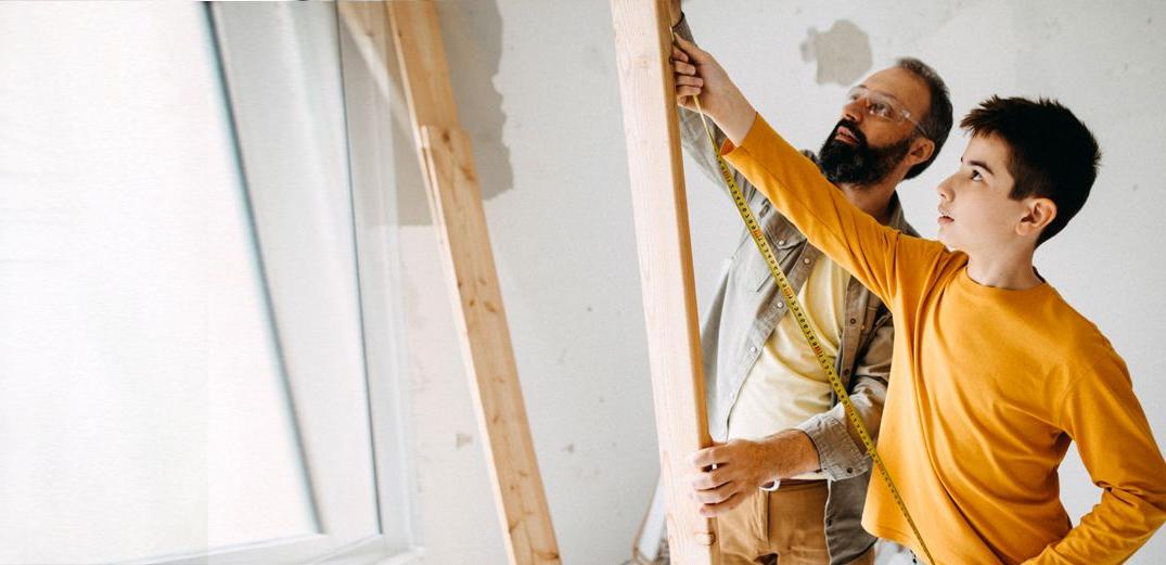 A father and son tackle a home improvement project.